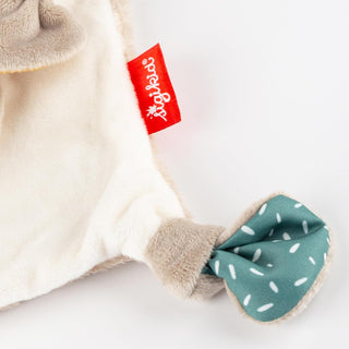 Sigikid Schnuffeltuch Drache, beige mit türkisfarbenem Knoten und rotem Sigikid-Etikett. Weicher Stoff, ideal für Babys.