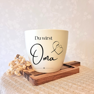 Beiger Blumentopf mit "Du wirst Oma" und Mutter-Kind-Motiv, Geschenk zur Geburt.