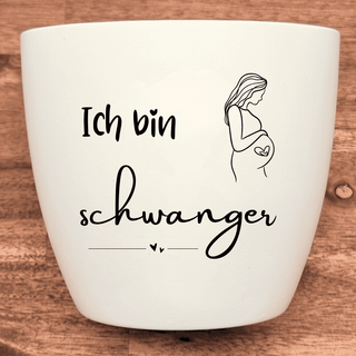 Weißer Blumentopf mit der Aufschrift "Ich bin schwanger" und einer Illustration einer schwangeren Frau. Schwangerschaft Ge...