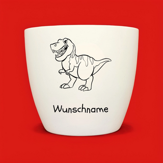 Weißer Blumentopf mit T-Rex-Motiv und "Wunschname" für das Naturmacher Pflanz-Set.