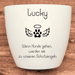 Weißer Gedenk-Blumentopf mit Pfotenabdruck, Flügeln, Heiligenschein und Schriftzug "Lucky".  "Wenn Hunde gehen, werden sie...